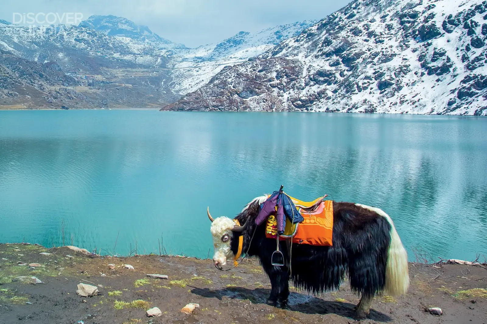 Why is the road to Tsomgo Lake an adventure in itself?